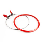 Nurge tension hoop with spring for secure embroidery or sewing.