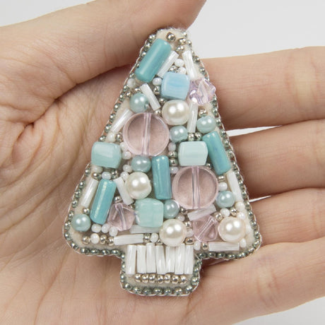 Close-up of intricate beadwork on the 'Blue Tree' brooch from Crystal Art.