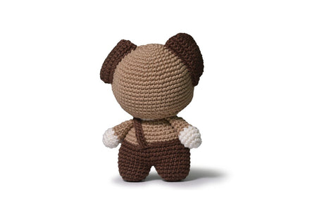 Completed Dog amigurumi on white background.