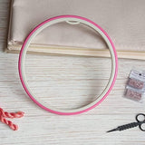Nurge hoop: plastic with rubbery outer ring.